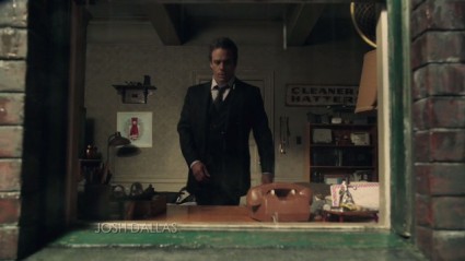 Neal Cassidy's Manhattan room (with "Cleaner and Hatters" sign in the background), as seen in episode 2x01 "Broken"