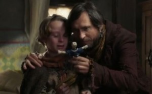 Young Rumple's father giving him the doll